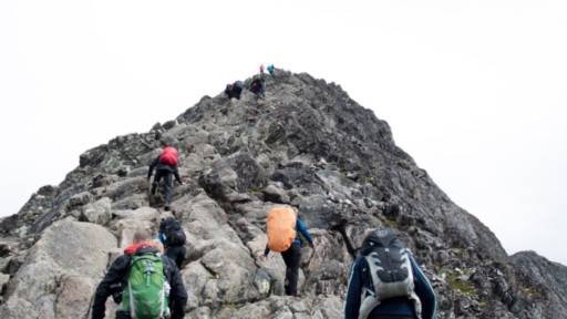 people climbing a mountain