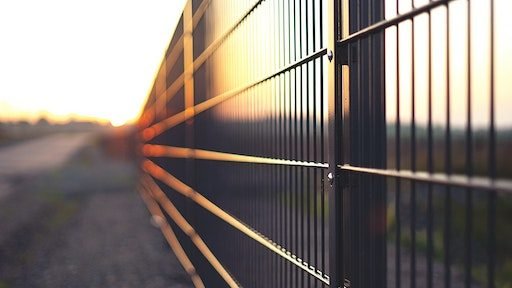 metal fence (Original photo by Simon Maage on Unsplash)