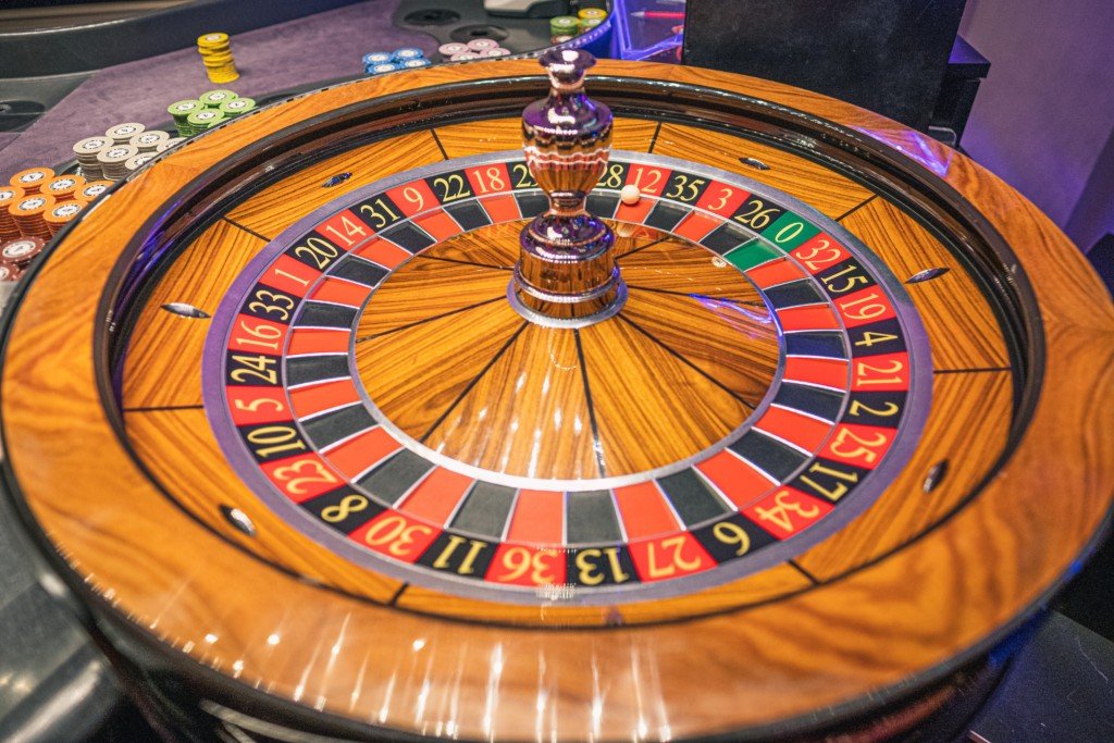 casino roulette wheel (Photo by Free Walking Tour Salzburg on Unsplash)