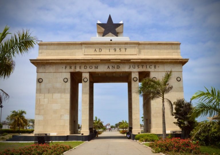 freedom arch with black star on top and freedom and justice inscribed